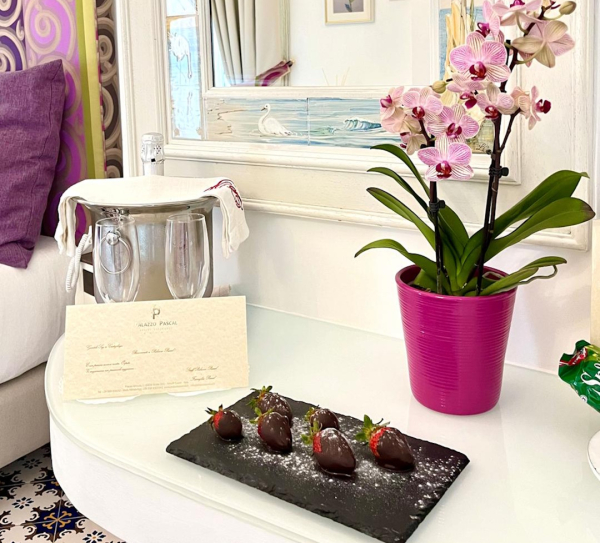 Signature breakfast served in room with gourmet pastries and elegant presentation in a luxury Amalfi Coast hotel