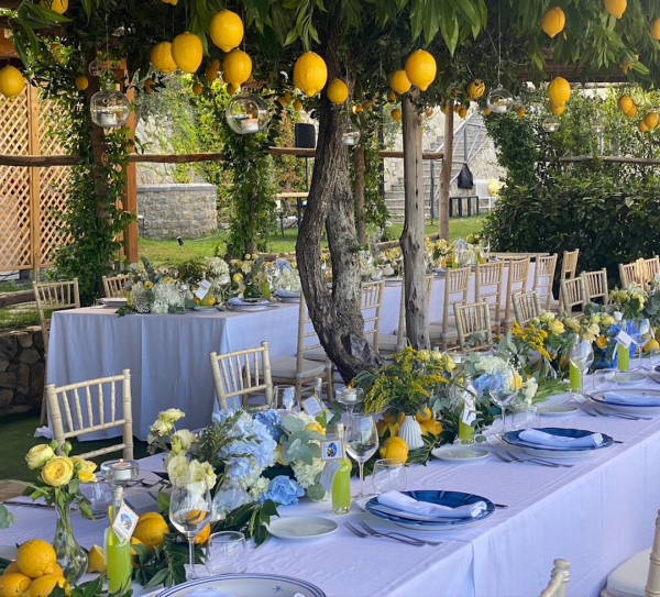 Elegant table setting among lemon trees for private celebrations and weddings at Palazzo Pascal on the Amalfi Coast